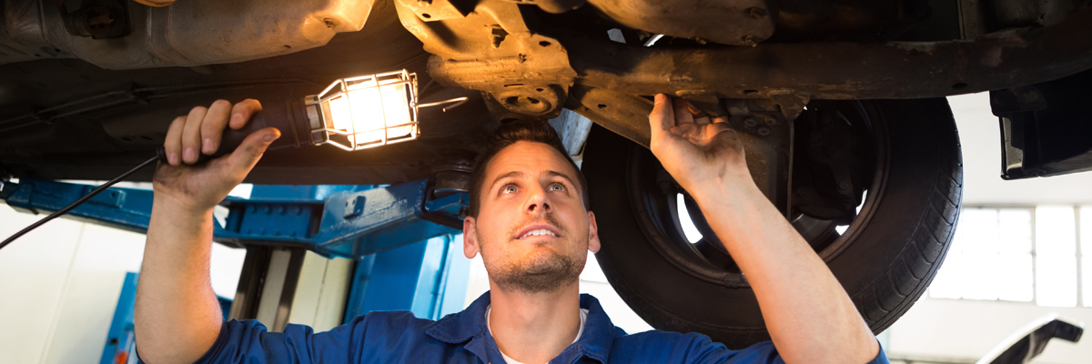 MOT Mechanic doing an inspection on a vehicle - MOT Preston