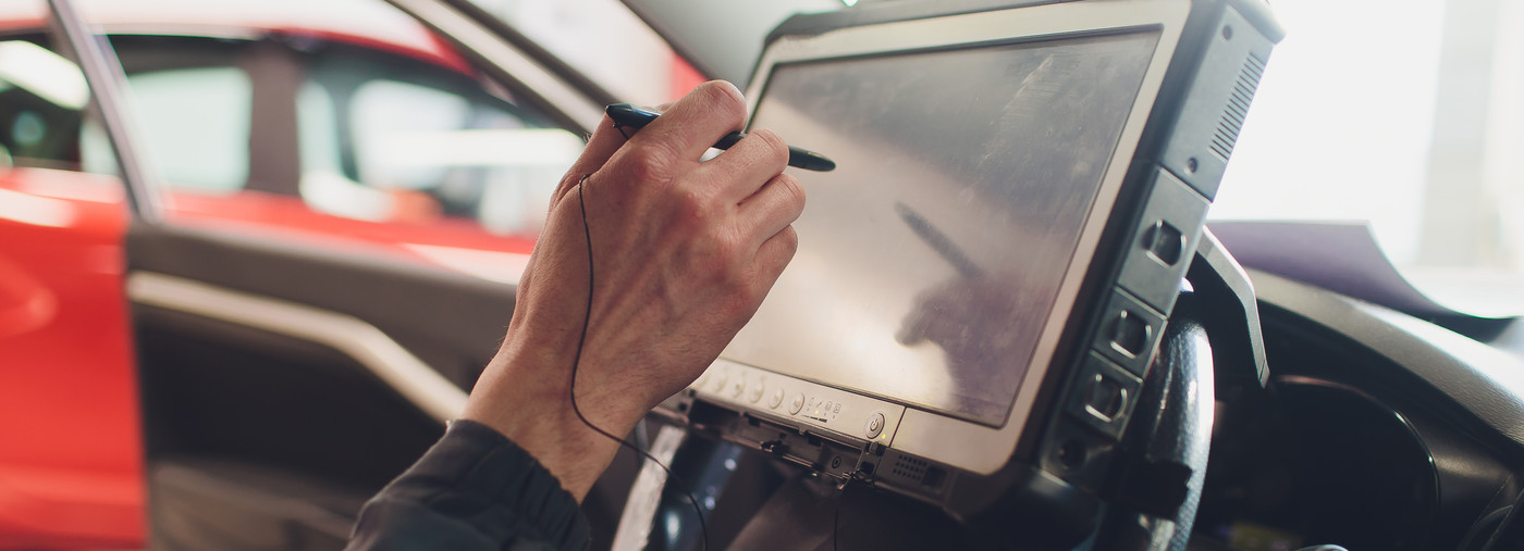 Mechanic diagnosing a vehicle using the latest equipment - Car Diagnostics Preston